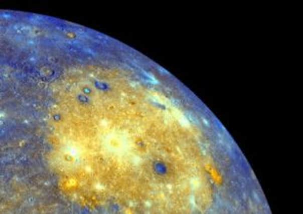 This image released by NASA shows an enhanced photo image of Mercury from its Messenger probe's 2008 flyby of the planet. NASA says it was a taste of pictures likely to come after March 17, 2011, when the probe enters Mercury's orbit. This photo shows the eastern part of the smallest and closest planet in our solar system. The colors in this picture are different than what would be seen with the naked eye, but show information about the different rock types and subtle color variations on the oddball planet. The bright yellow part is the Caloris impact basin, which is the site of one of the biggest in the solar system. Earth is about to get better acquainted with its oddball planetary cousin. (AP Photo/NASA/Johns Hopkins University Applied Physics Laboratory/Arizona State University/Carnegie Institution of Washington)