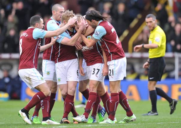 Burnley's Scott Arfield is mobbed by team mates after scoring the opening goal

Photographer Dave Howarth/CameraSport

Football - Barclays Premiership - Burnley v Queens Park Rangers - Saturday 10th January 2015 - Turf Moor - Burnley

© CameraSport - 43 Linden Ave. Countesthorpe. Leicester. England. LE8 5PG - Tel: +44 (0) 116 277 4147 - admin@camerasport.com - www.camerasport.com