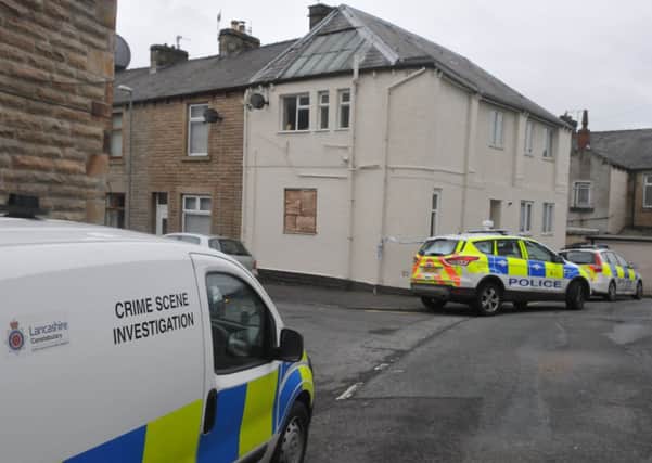 Police at the scene of the suspected murder in Clifton Street.