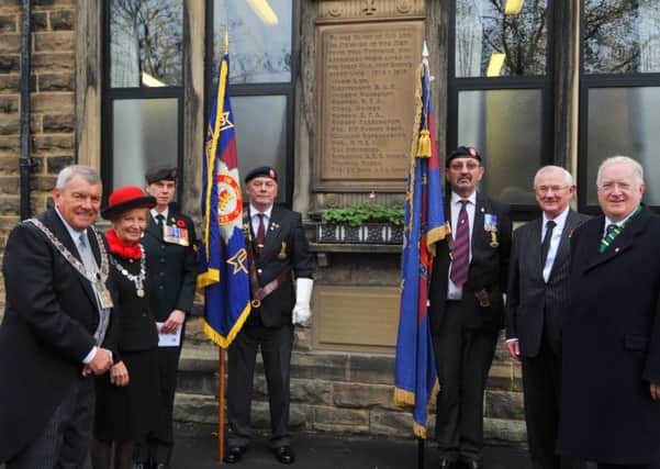 Mayor and Mayoress of the Ribble Valley Coun. Michael Ranson and Janette Ranson, company clerk of the Royal Regina Rifles Corporal Stacey Bouck, standard bearers John McCarthy and Leonard Key, deputy lieutenant Michael Kershaw and parish council chairman David Peat, at the new war memorial outside St Peter's Church, Simonstone.