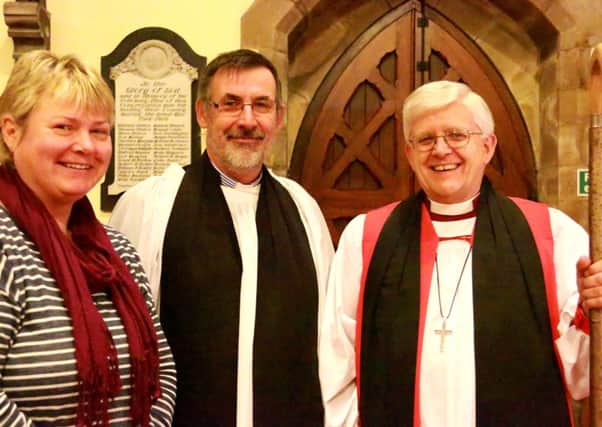 The Rev. Mark Pickett has been licensed as Priest in Charge of St Pauls, Low Moor. Pictured are, from left, Mrs Della Pickett,Mr Pickett and the Bishop of Blackburn.