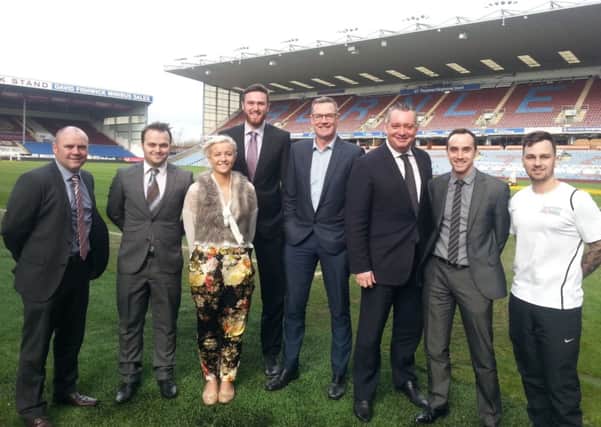 KICKING ON: Members of Burnley Football Club's commercial department with fitness trainer Jamie Kennedy