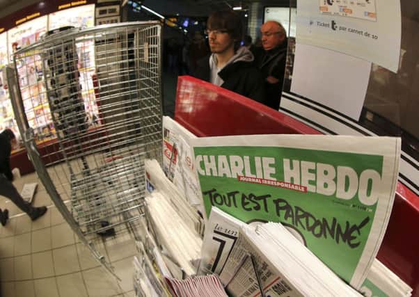 Charlie Hebdo (AP Photo/David Vincent)