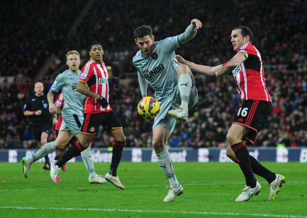 Lukas Jutkiewicz shields the ball from Sunderland's John O'Shea