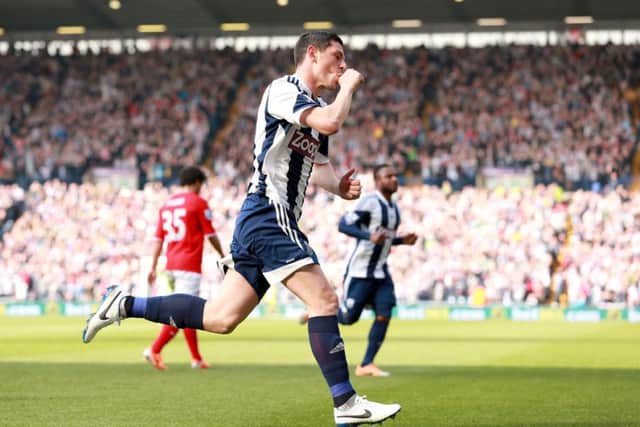 West Bromwich Albion's Graham Dorrans (centre) celebrates scoring their second goal of the game during the Barclays Premier League match at the Hawthorns, West Bromwich. PRESS ASSOCIATION Photo. Picture date: Saturday March 29, 2014. See PA Story SOCCER West Brom. Photo credit should read: David Davies/PA Wire. Editorial use only. Maximum 45 images during a match. No video emulation or promotion as 'live'. No use in games, competitions, merchandise, betting or single club/player services. No use with unofficial audio, video, data, fixtures or club/league logos.
