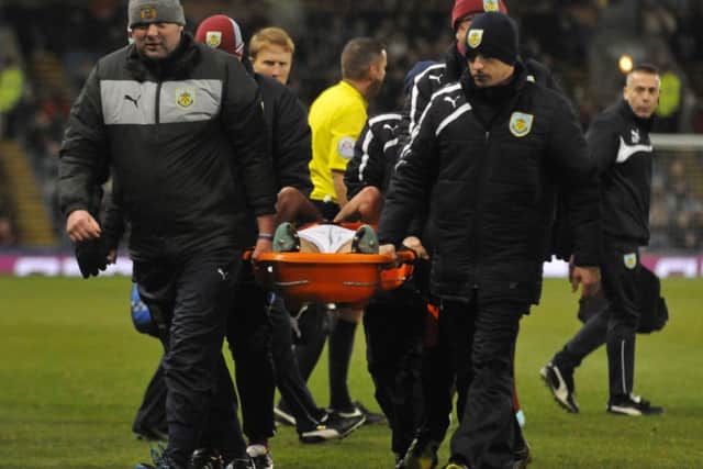 Stephen Ward is carried off the pitch.