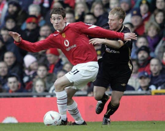 Manchester United's David Jones (L) challenges Exeter's Andy Taylor for the ball during the FA Cup third round match at Old Trafford, Saturday January 8, 2005. PRESS ASSOCIATION Photo. Photo credit should read: Phil Noble/PA.
THIS PICTURE CAN ONLY BE USED WITHIN THE CONTEXT OF AN EDITORIAL FEATURE. NO WEBSITE/INTERNET USE UNLESS SITE IS REGISTERED WITH FOOTBALL ASSOCIATION PREMIER LEAGUE.