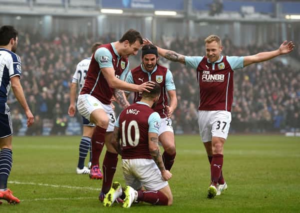 Burnley's Ashley Barnes celebrates scoring his teams first goal against West Bromwich Albion with Danny Ings.  Photo: Martin Rickett/PA Wire.