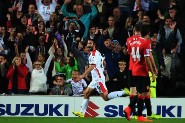 Millton Keynes Dons' Will Grigg  scores 2nd goal against Manchester United during the Capital One Cup Second Round match at Stadium:mk, Milton Keynes. PRESS ASSOCIATION Photo. Picture date: Tuesday August 26, 2014. See PA story SOCCER MK Dons. Photo credit should read: Nick Potts/PA Wire. RESTRICTIONS: Editorial use only. Maximum 45 images during a match. No video emulation or promotion as 'live'. No use in games, competitions, merchandise, betting or single club/player services. No use with unofficial audio, video, data, fixtures or club/league logos.