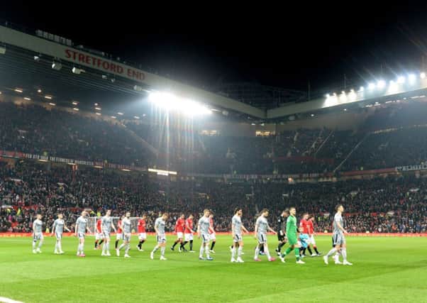 Burnley walk out in front of the Stretford End at Old Trafford on Wednesday night