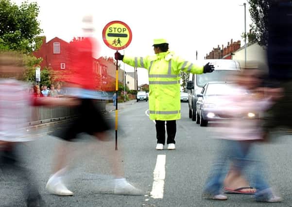 Lollipop lady.
PICTURE BY MATTHEW PAGE