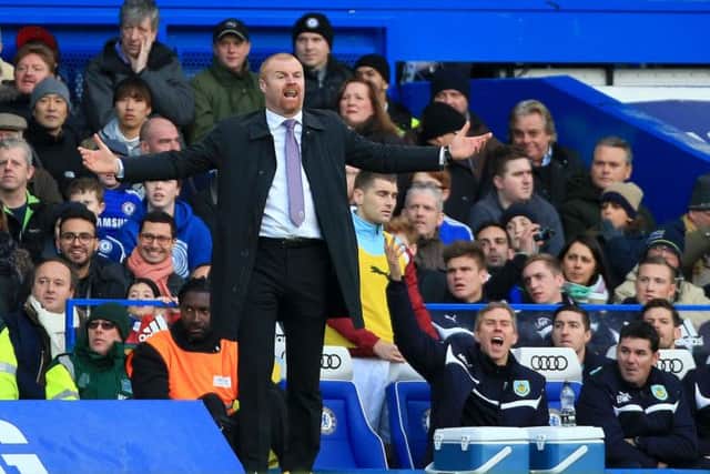 Burnley manager Sean Dyche on the touchline during the Barclays Premier League match at Stamford Bridge, London. PRESS ASSOCIATION Photo. Picture date: Saturday February 21, 2015. See PA story SOCCER Chelsea. Photo credit should read: Nick Potts/PA Wire. RESTRICTIONS: Editorial use only. Maximum 45 images during a match. No video emulation or promotion as 'live'. No use in games, competitions, merchandise, betting or single club/player services. No use with unofficial audio, video, data, fixtures or club/league logos.
