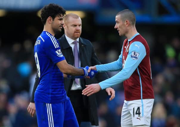Chelsea's Diego Costa (centre) and Burnley's David Jones shake hands after match. Photo: Nick Potts/PA Wire.