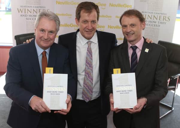 Alastair Campbell with his new book 'Winners' at the launch at Turf Moor with Paul Fletcher and Tim Oldfield.