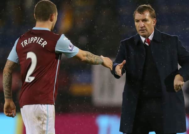 Liverpool manager Brendan Rodgers shakes hands with Kieran Trippier following their 1-0 win over Burnley at Turf Moor in December