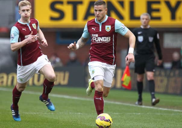 Burnley's Michael Kightly on the ball followed closely by team-mate Ben Mee 

Photo: Rich Linley/CameraSport

Football -