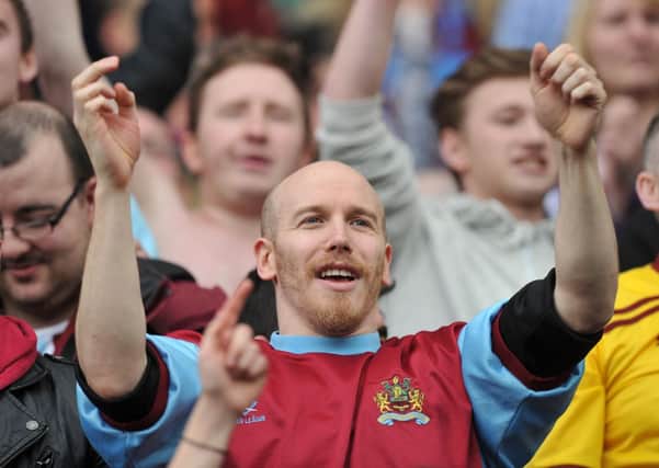 A Burnley fan celebrates

 Photo by Dave Howarth/CameraSport