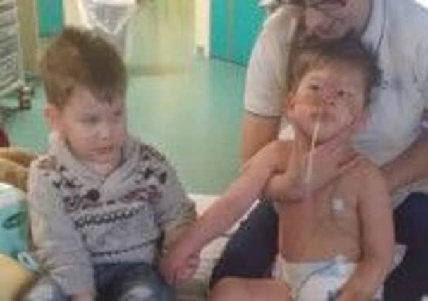 Thomas Procter-Whitham (right) with twin brother George at Alder Hey Children's Hospital in Liverpool. (S)
