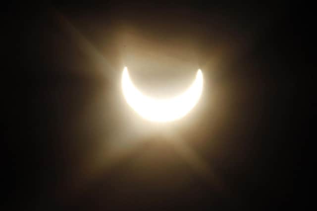 A partial solar eclipse in Austria, in 2011. (AP Photo/Ronald Zak)