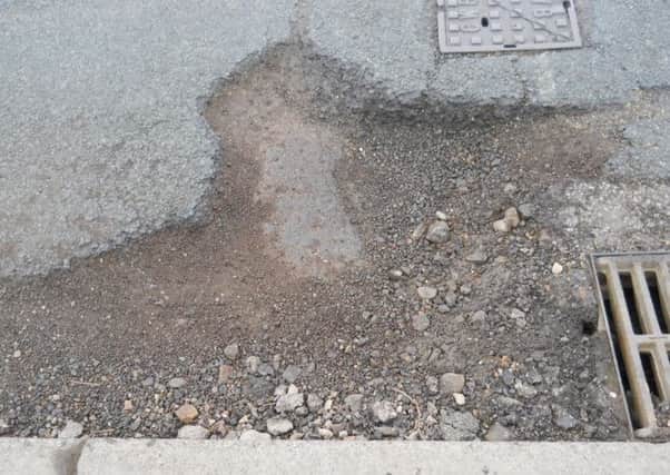 pothole (s)