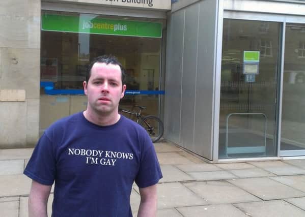 NOT CHANGING: Job-seeker Shaun Clark wears his T-shirt outside Burnley Jobcentre