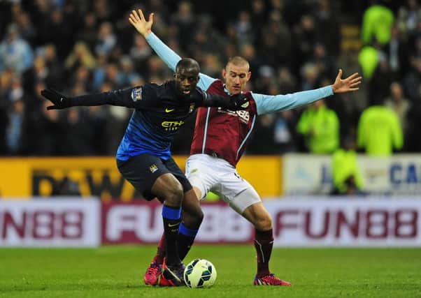 David Jones tries to hold off Manchester Citys Yaya Toure