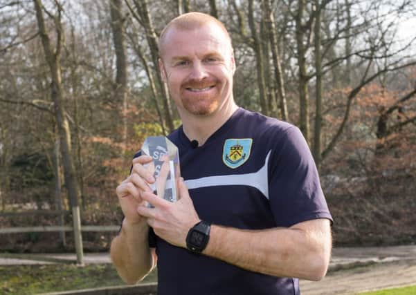 Sean Dyche proudly shows off the LG LMA Performance of the Week Award