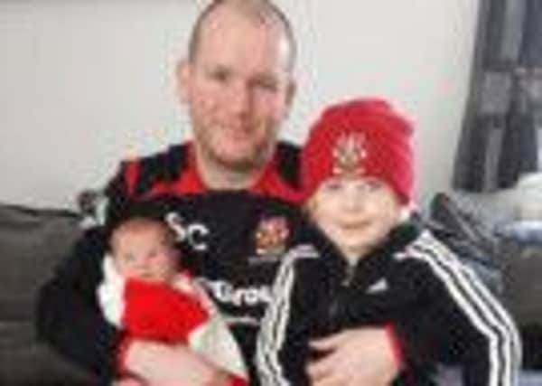 HAPPY FAMILY: Colne FC manager Steve Cunningham with Maizie Jane and Zak (S)