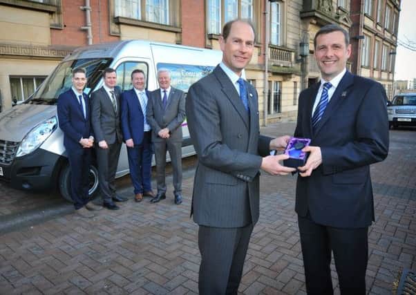 Royal engagement: Prince Edward the Earl of Wessex with Ian Cartwright, of Dine Contract Catering, accepting a minibus on behalf of the Duke of Edinburgh Award Scheme at County Hall in Preston