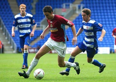Michael Duff gets away from Reading's Paul Brooker in his first season at Turf Moor