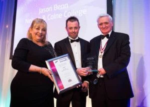 Jason Benn receiving award