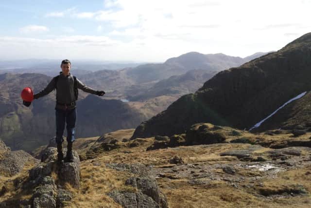 Reporter Dom Collis at the summit of Pavey Ark