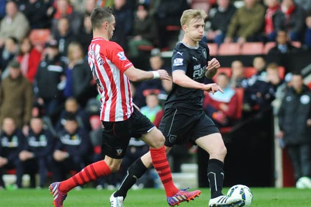 Ben Mee under pressure from Southampton's Morgan Schneiderlin