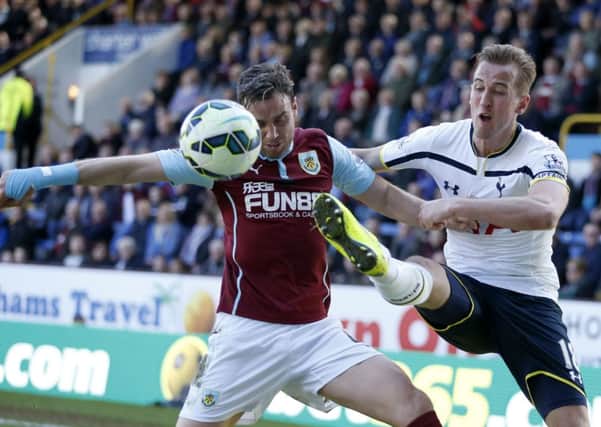 Tottenham Hotspur's Harry Kane (right) and Burnley's Michael Duff (left) battle for the ball during the Barclays Premier League match at Turf Moor, Burnley. PRESS ASSOCIATION Photo. Picture date: Sunday April 5, 2015. See PA story SOCCER Burnley. Photo credit should read: Lynne Cameron/PA Wire. RESTRICTIONS: Editorial use only. Maximum 45 images during a match. No video emulation or promotion as 'live'. No use in games, competitions, merchandise, betting or single club/player services. No use with unofficial audio, video, data, fixtures or club/league logos.