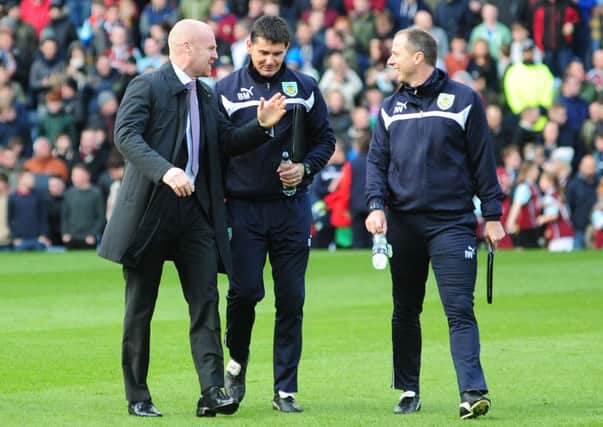 Think tank: Clarets boss Sean Dyche with goalkeeping coach Billy Mercer and assistant manager Ian Woan