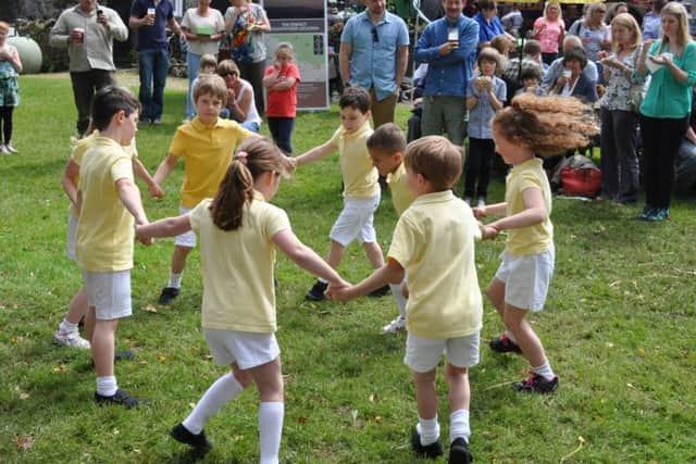 Slaidburn Steam Fair 2014. Children from Brennand's Endowed Primary School give a demonstration of country dancing.