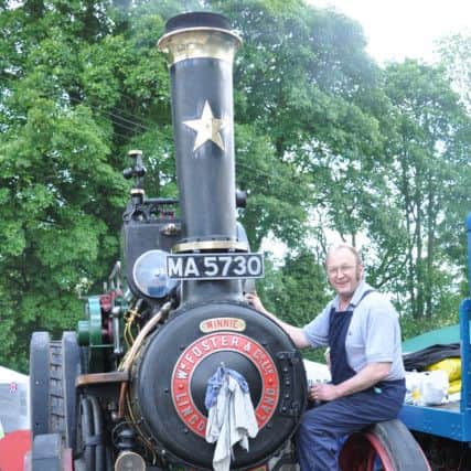 Slaidburn Steam Fair 2014. Exhibitor Phil Moston with his 1910 traction engine.
