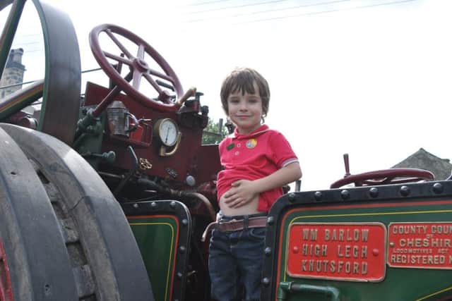 Slaidburn Steam Fair 2014. Birthday boy Corrie Wood, of Slaidburn, aboard one of the traction engines.