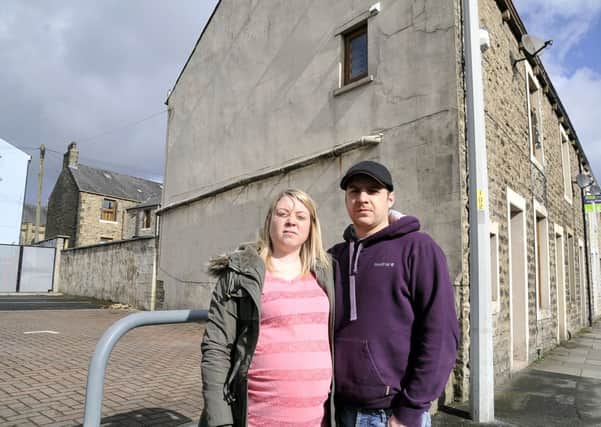 Anna Bliss and Simon Highland outside their house next to Majestic Wine Merchants in Clitheroe