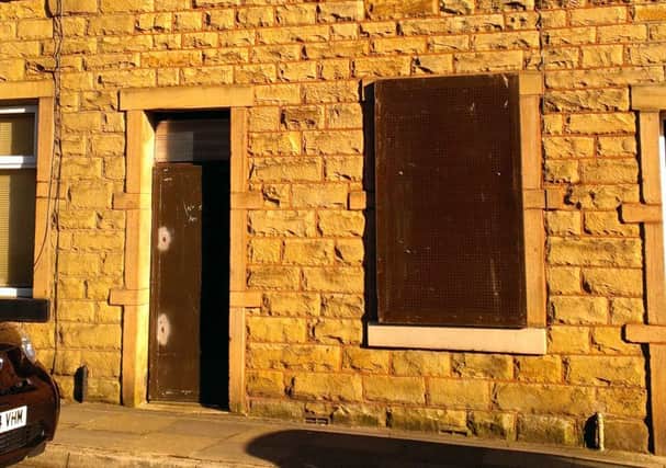 The property in Walton Street, Barrowford, which has been boarded up in error by a contractor who should have been sealing up a house with the same address in Nelson.