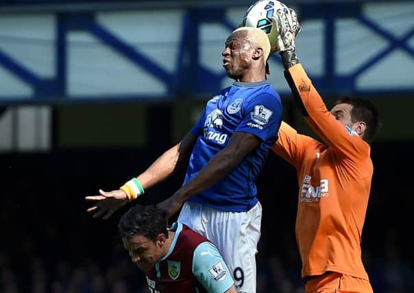 Tom Heaton saves off the head of Everton striker Kone
