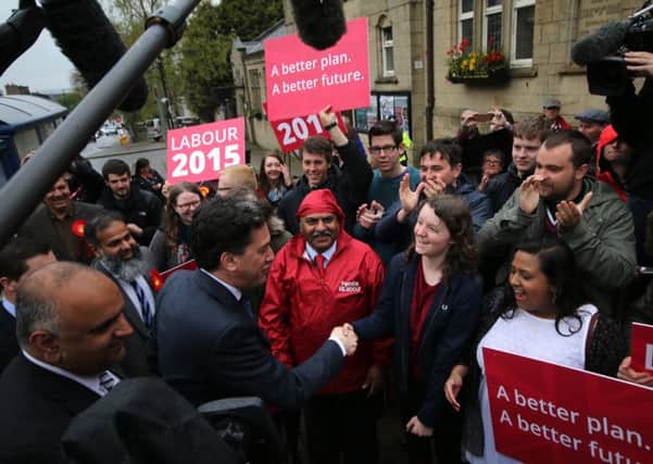 Labour leader Ed Miliband is welcomed by supporters as he arrives at the Colne Muni.