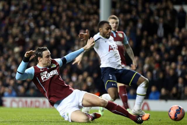 Michael Duff in a typical robust challenge with Tottenham's Danny Rose