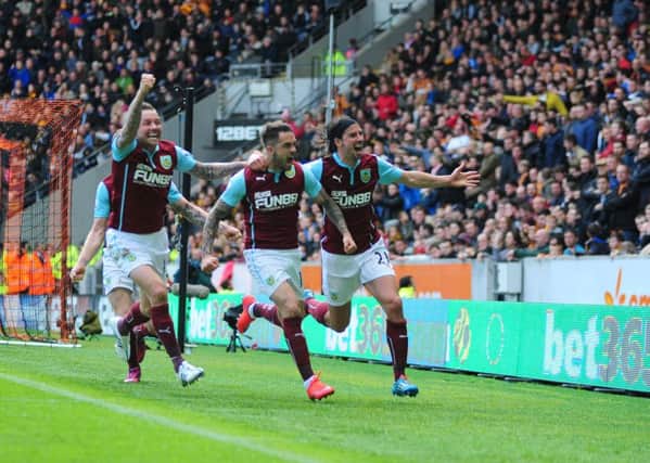 Burnley's Danny Ings, centre, celebrates scoring the opening goal with team-mates Scott Arfield, left, and George Boyd 

Photographer: Chris Vaughan/CameraSport

Football