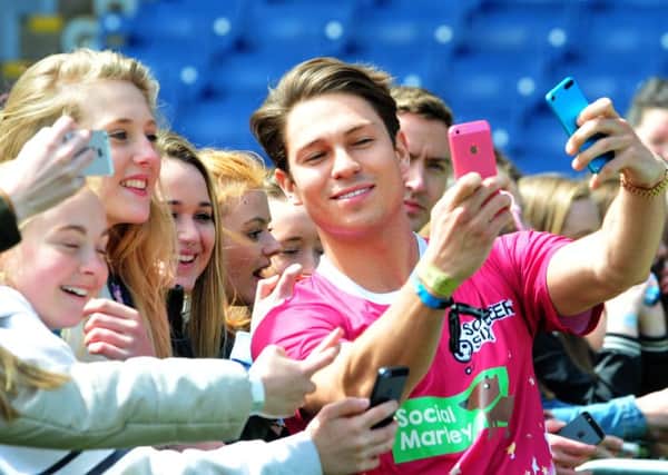 Photo: David Hurst
Two selfies from Joey Essex at the soccer Six celebrity football event held at Turf Moor.
