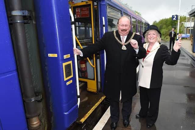Just the ticket: The Mayor and Mayoress of Burnley, Coun. Andy Tatchell and Mrs Lorna Tatchell get ready to wave off the train to Manchester