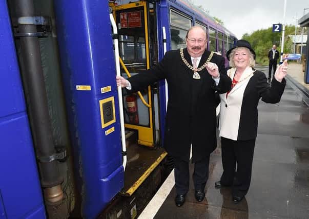 Just the ticket: The Mayor and Mayoress of Burnley, Coun. Andy Tatchell and Mrs Lorna Tatchell get ready to wave off the train to Manchester
