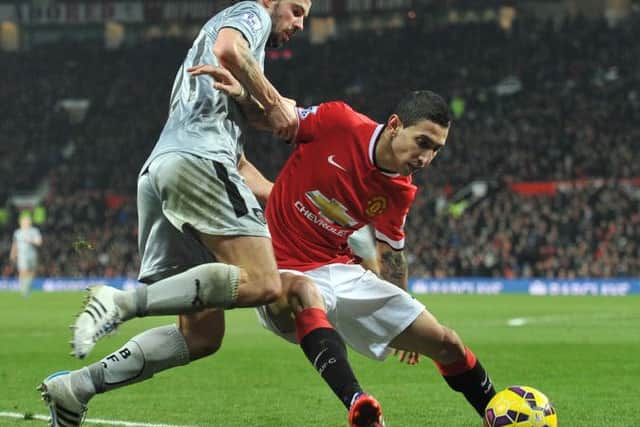 George Boyd and Manchester Uniteds Ángel Di Maria battle for the ball