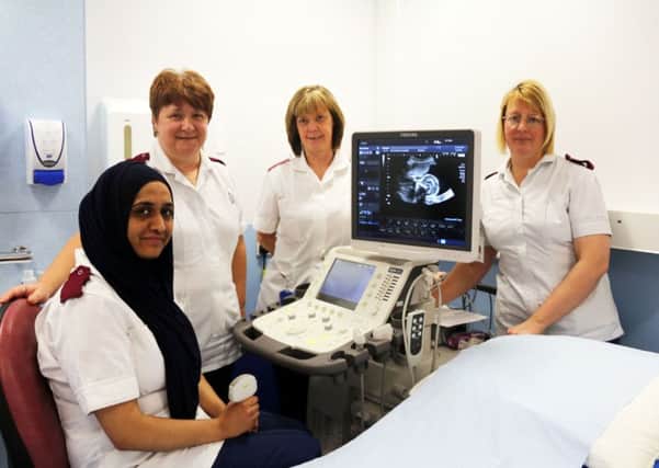 Staff pictured with the new Aplio 500 in the Antenatal department of the Royal Blackburn Hospital, Sonographer Raeesa Dawjee (seated),  Clinical Lead Sonographer Julie White,  Radiographer Assistant Geralyn Hall and Deputy Clinical Lead Sonographer Philippa Staines.