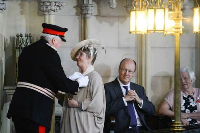 Margot Small receives her MBE (s)